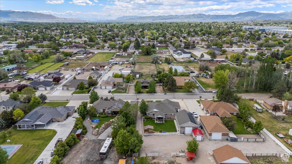 Aerial perspective of suburban area with a mountainous background