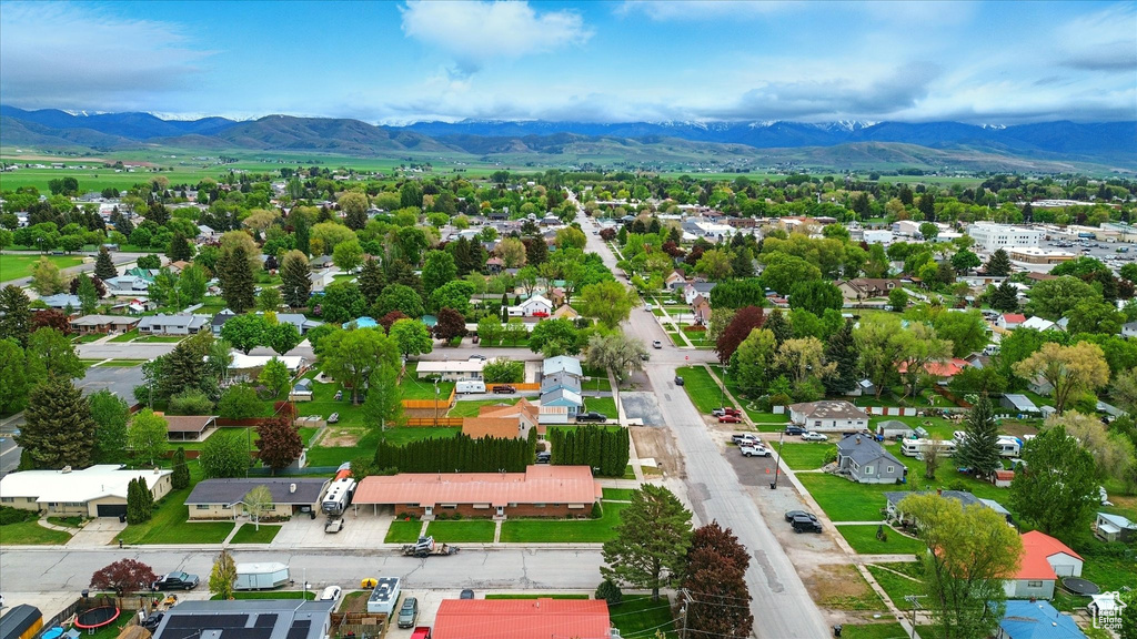 Aerial perspective of suburban area with a mountainous background