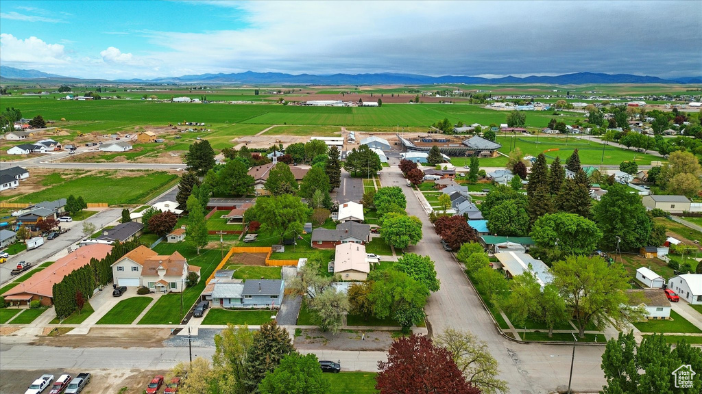 Aerial view of residential area featuring a mountainous background