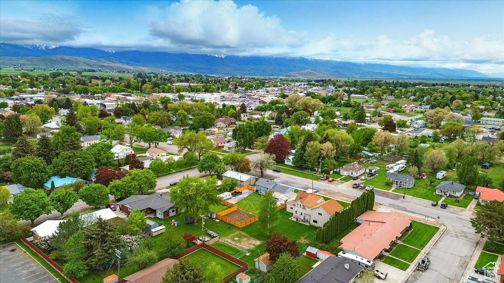 Aerial view of residential area featuring a mountainous background
