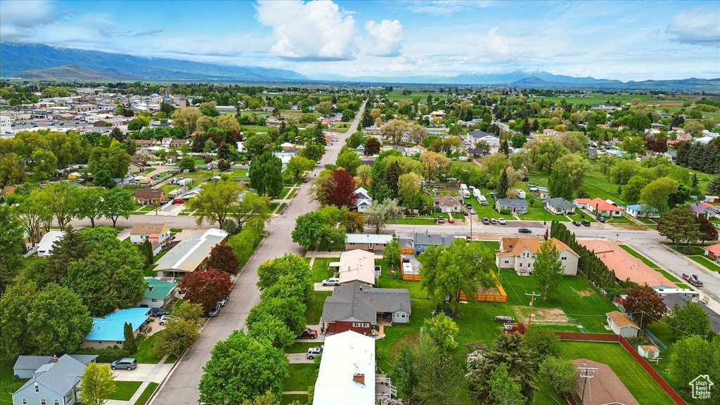 Aerial perspective of suburban area with a mountainous background
