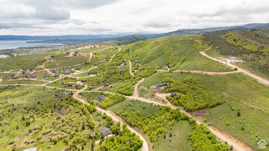 View of property location with a water and mountain view