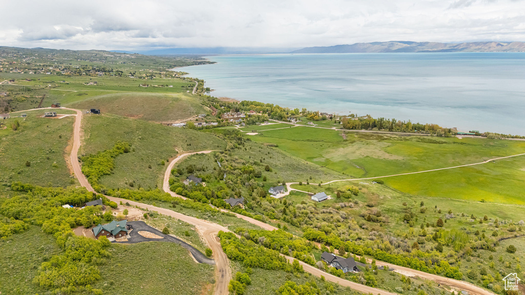 View of property location with a water and mountain view