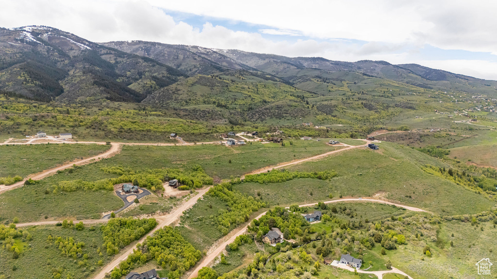 View of property location featuring mountains and rural landscape