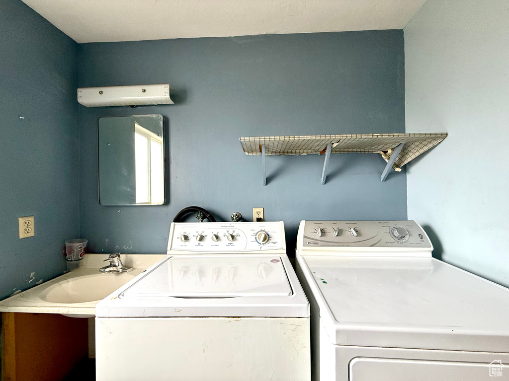 Laundry area featuring washing machine and clothes dryer