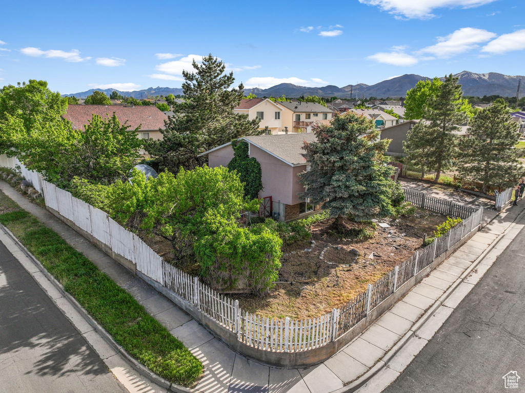 View of mountain backdrop featuring nearby suburban area