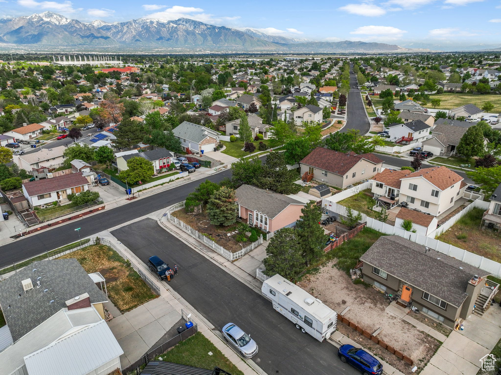 Aerial view of residential area featuring mountains