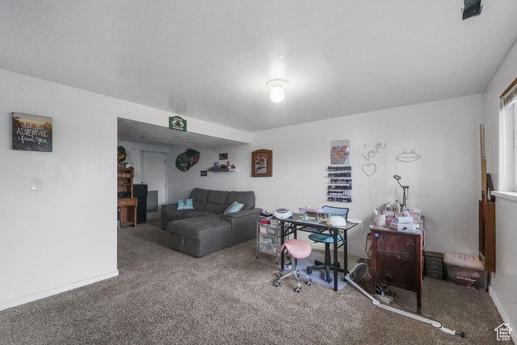 Carpeted office with baseboards