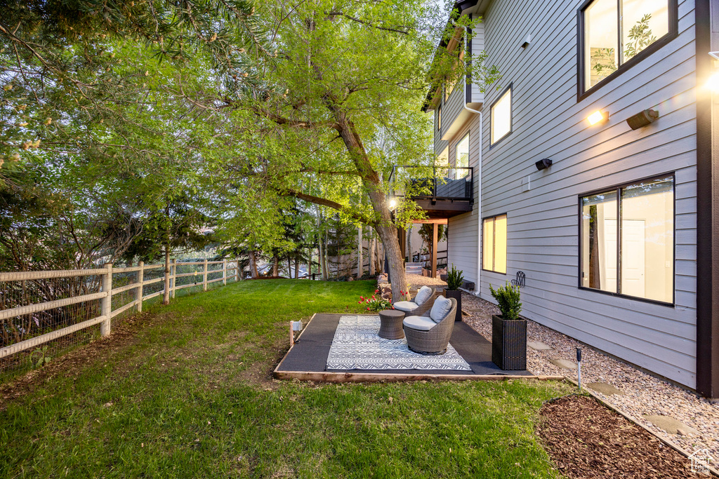 View of yard with a patio and a balcony