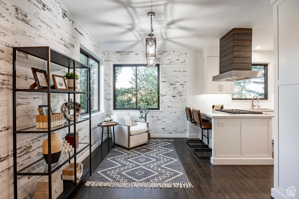 Dining area featuring dark wood finished floors and baseboards