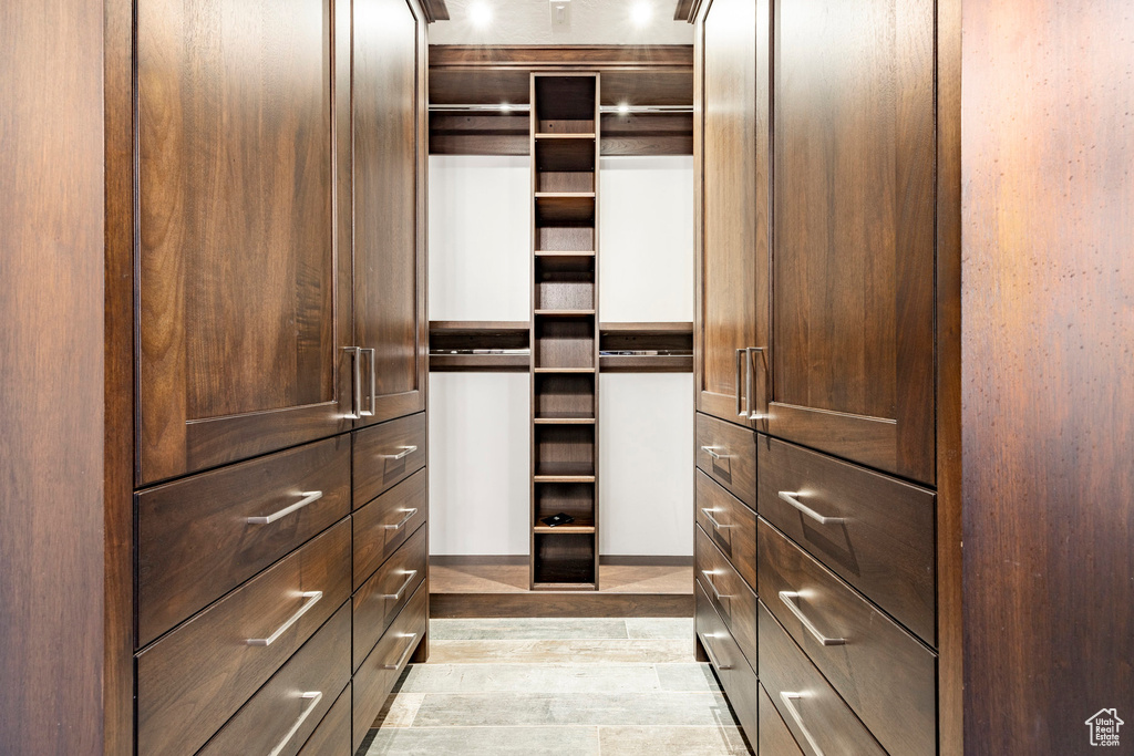 Walk in closet featuring light wood-type flooring