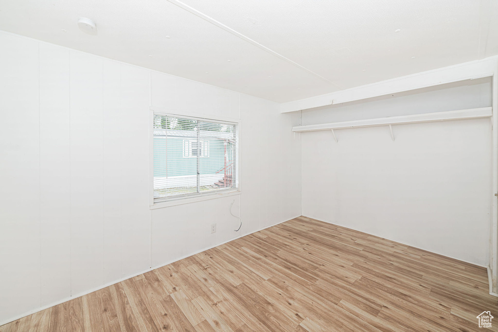 Empty room featuring light wood-style floors