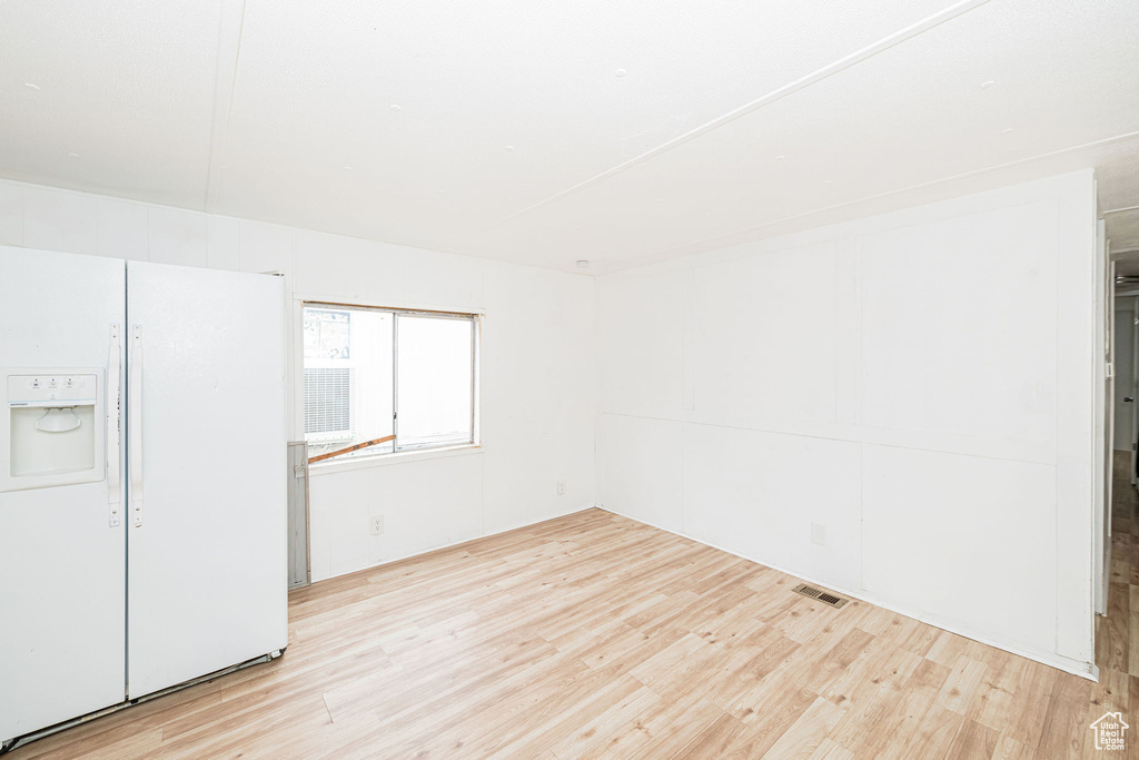 Unfurnished room featuring wood finished floors