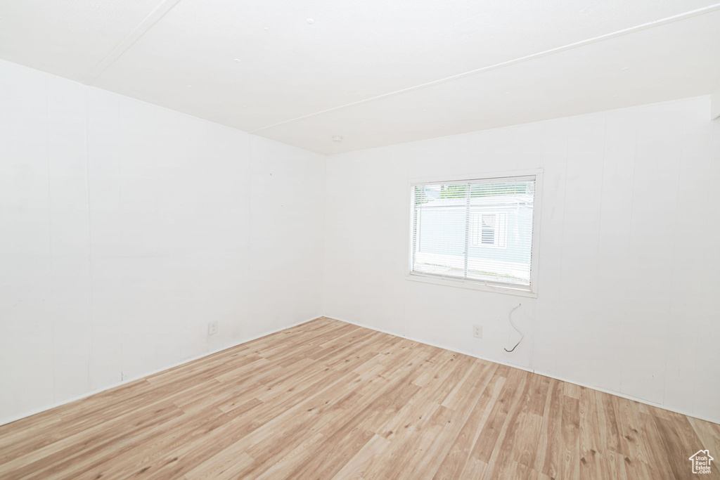 Unfurnished room with wood finished floors