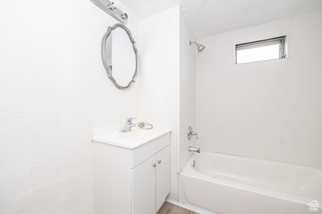 Bathroom with bathtub / shower combination and vanity