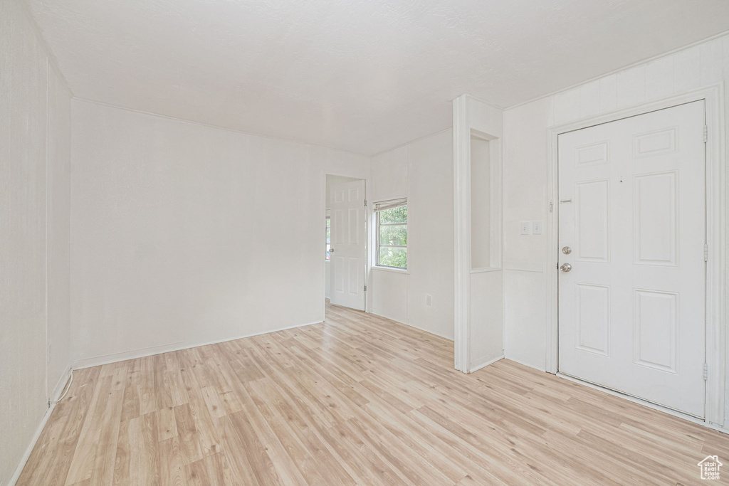 Empty room with light wood-style flooring