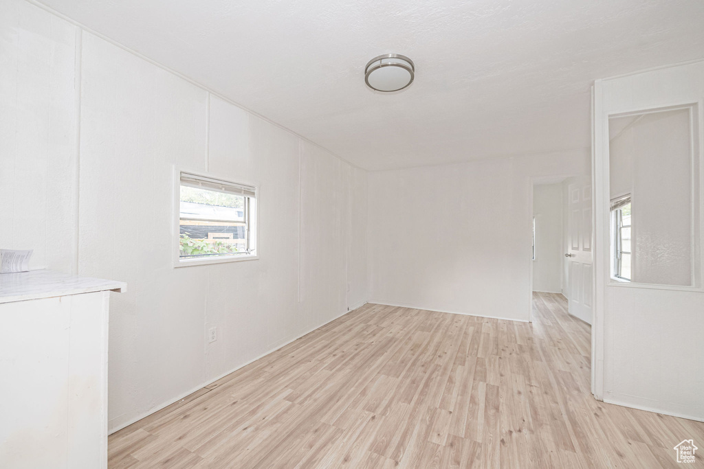 Empty room with light wood-type flooring