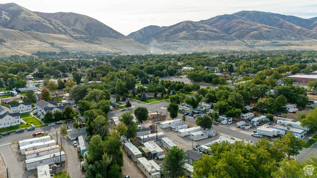Aerial view of property and surrounding area with mountains