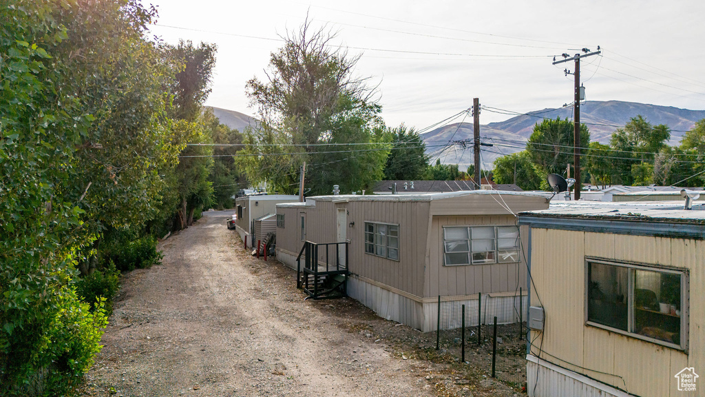 View of property exterior with a mountain view