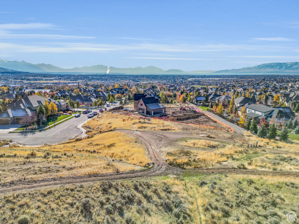 Aerial perspective of suburban area with a mountain backdrop