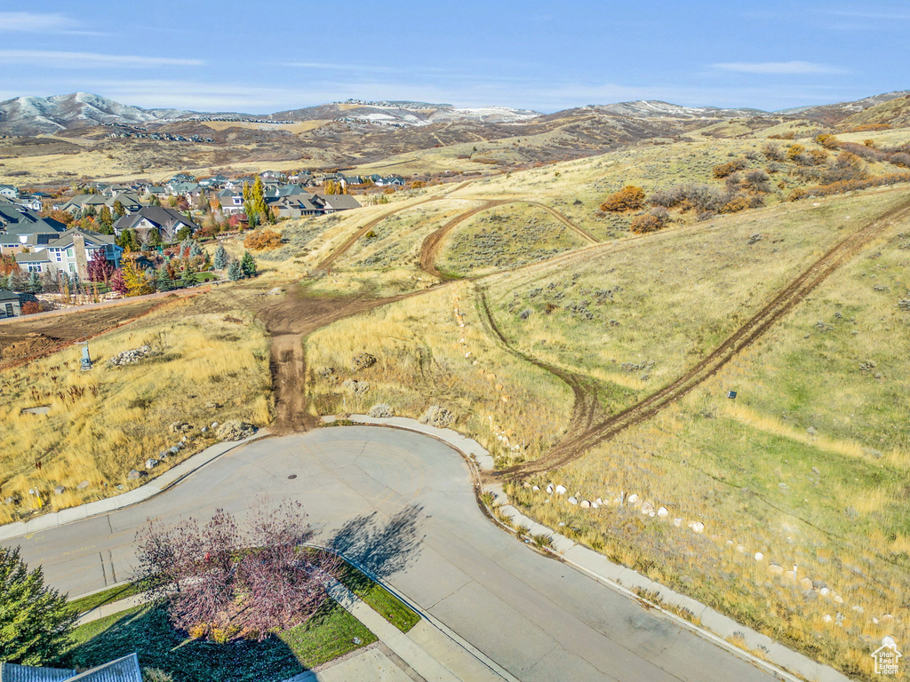Aerial perspective of suburban area featuring a mountainous background