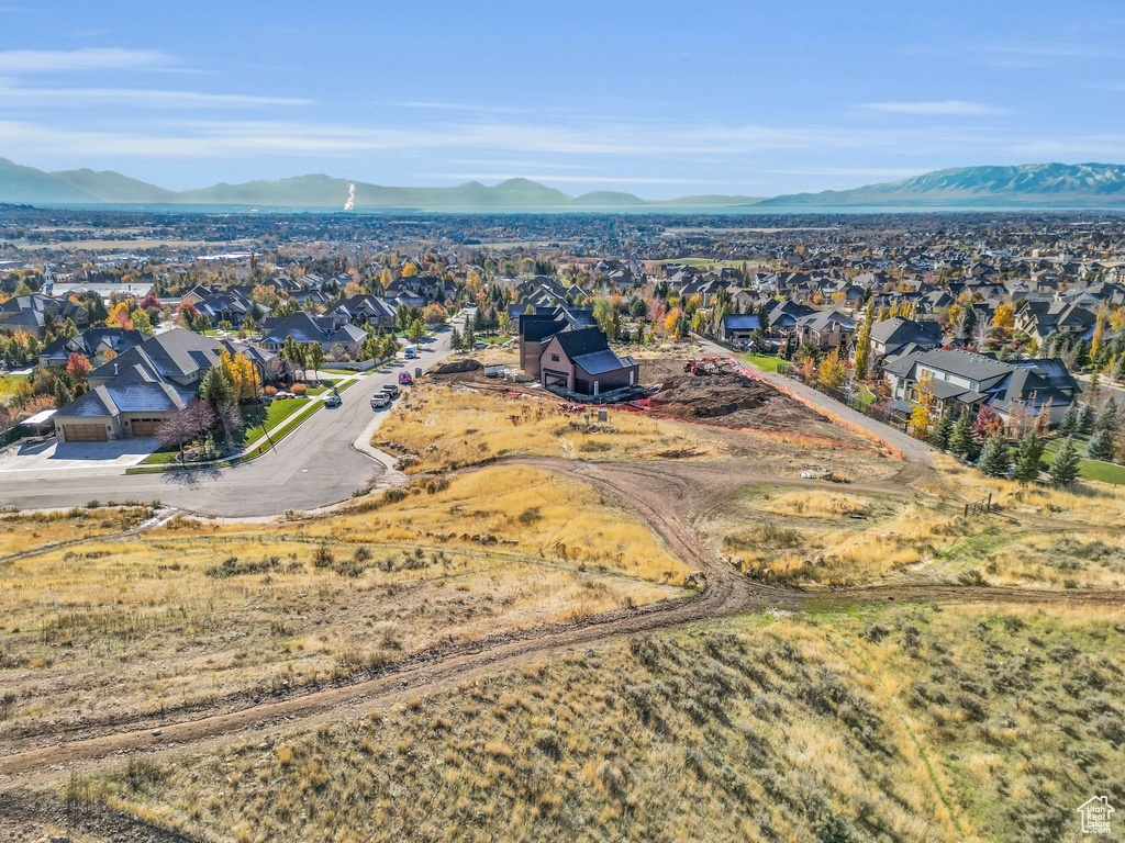 Aerial perspective of suburban area with a mountain backdrop