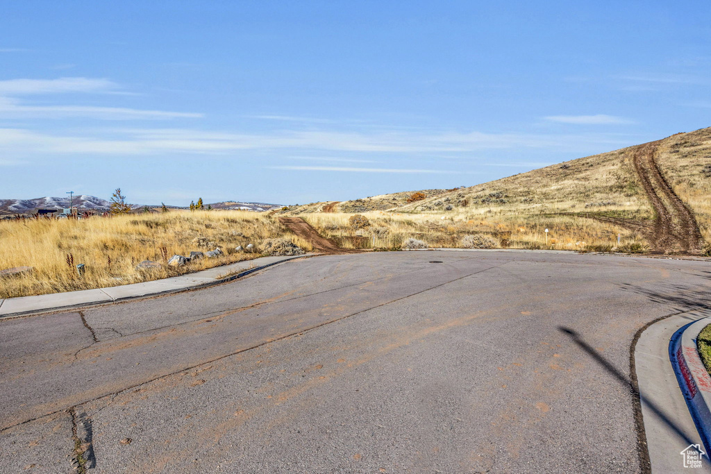 View of asphalt road featuring a mountain view