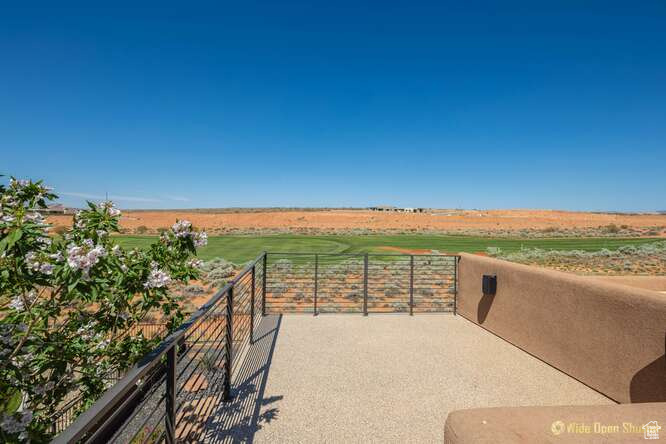 View of patio / terrace featuring a rural view and a balcony