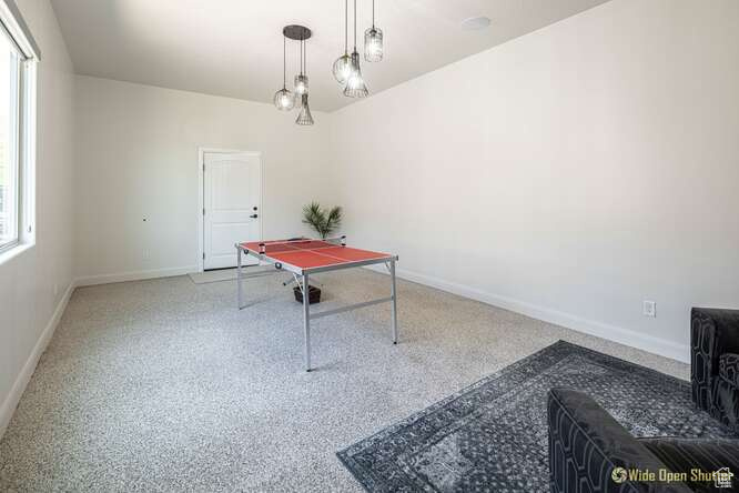 Rec room featuring healthy amount of natural light and baseboards