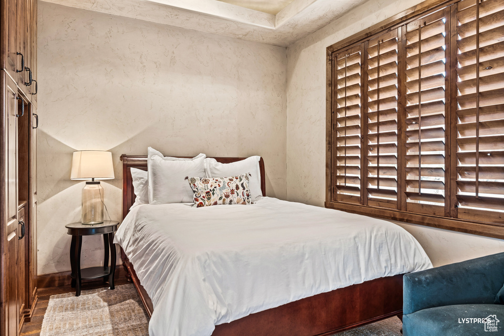 Bedroom with wood finished floors