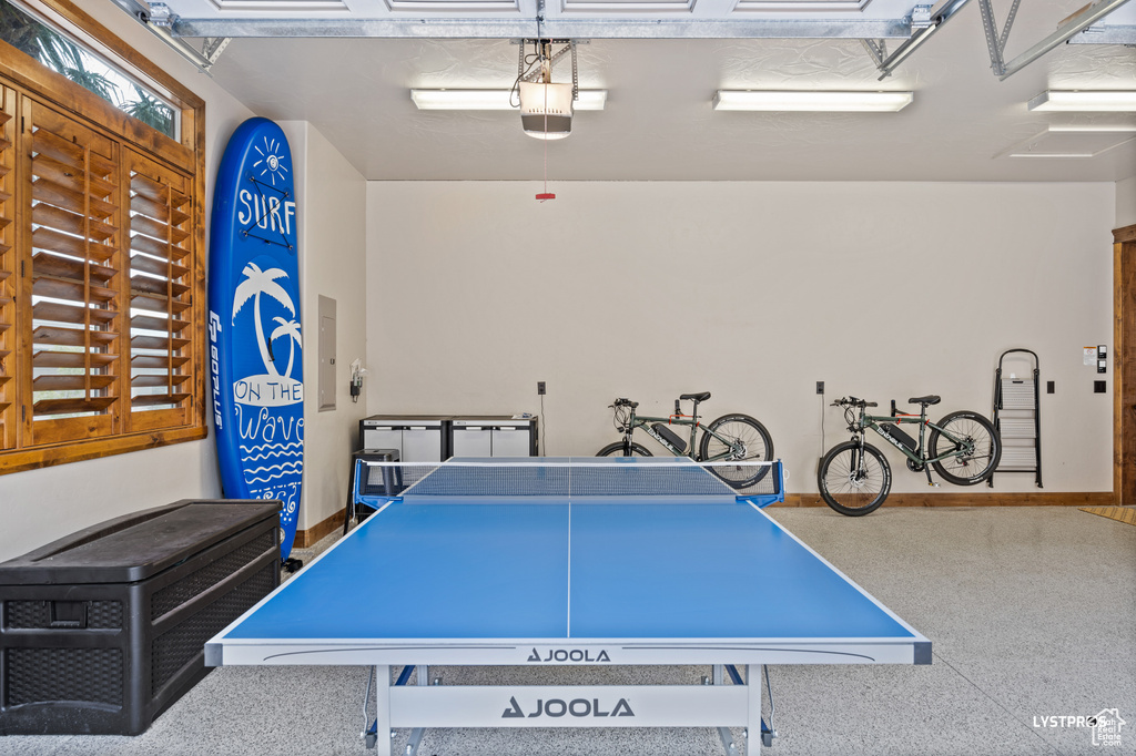 Playroom with a garage and baseboards