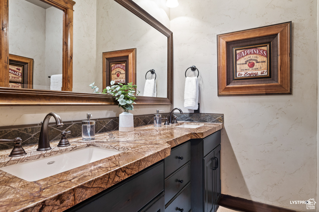Full bath featuring double vanity