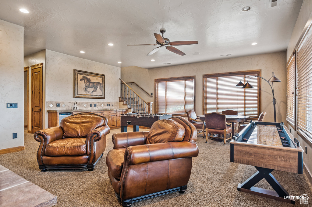 Living area with a ceiling fan, carpet flooring, recessed lighting, and baseboards