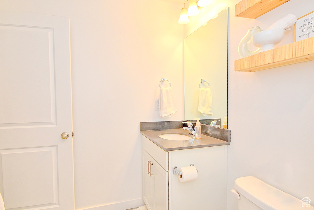 Bathroom featuring toilet and vanity