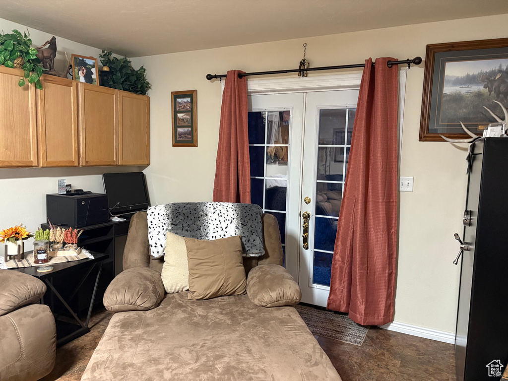 Living room with french doors and baseboards