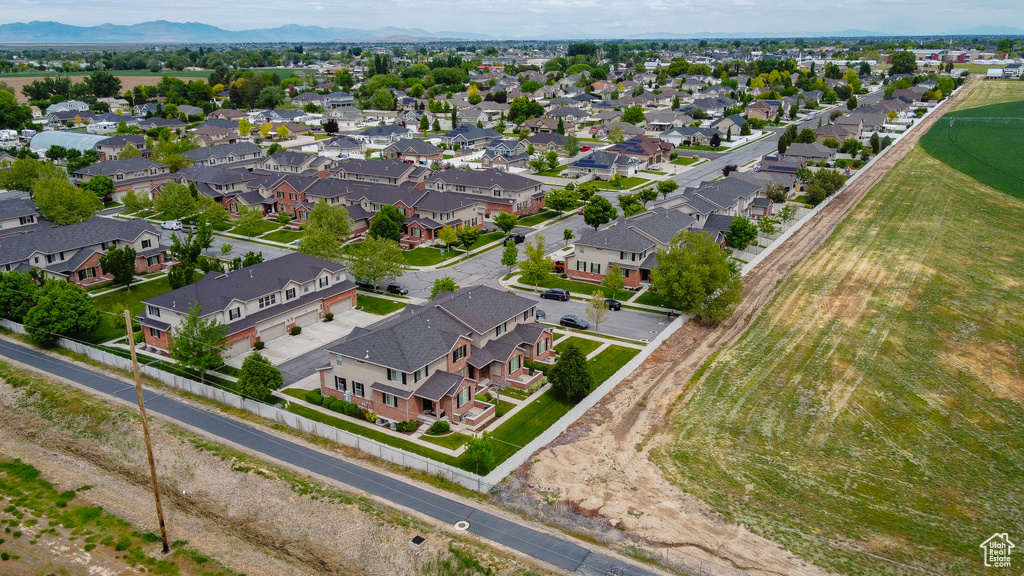 Aerial view of residential area featuring mountains