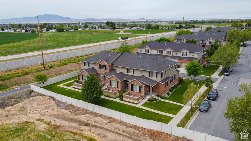 Aerial view of residential area featuring a mountain backdrop