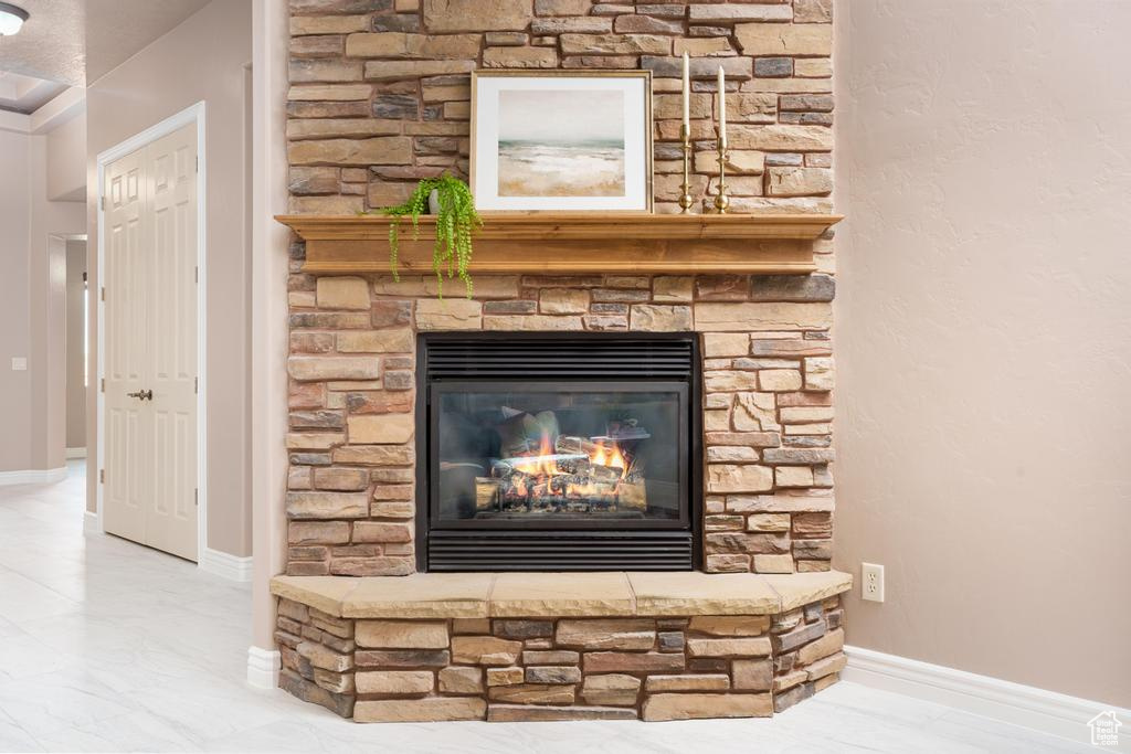 Detailed view of a fireplace and baseboards