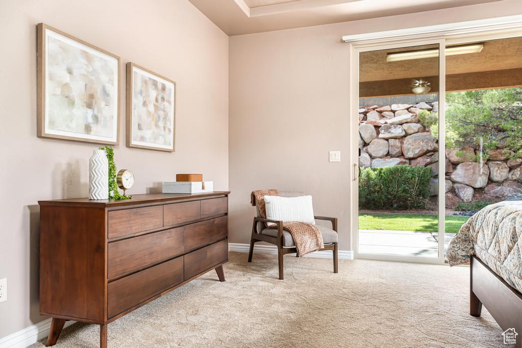 Carpeted bedroom featuring access to outside, multiple windows, and baseboards