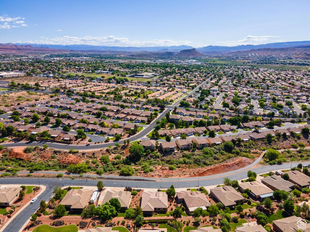 Aerial view of residential area featuring a mountainous background