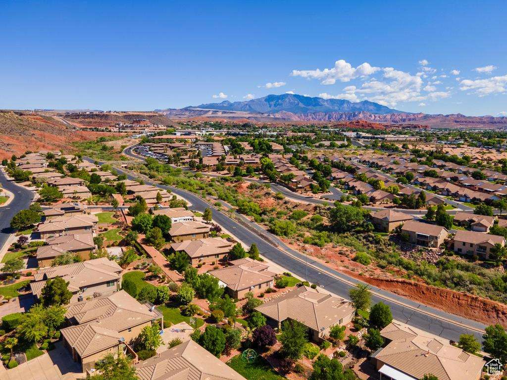 Aerial perspective of suburban area featuring a mountainous background