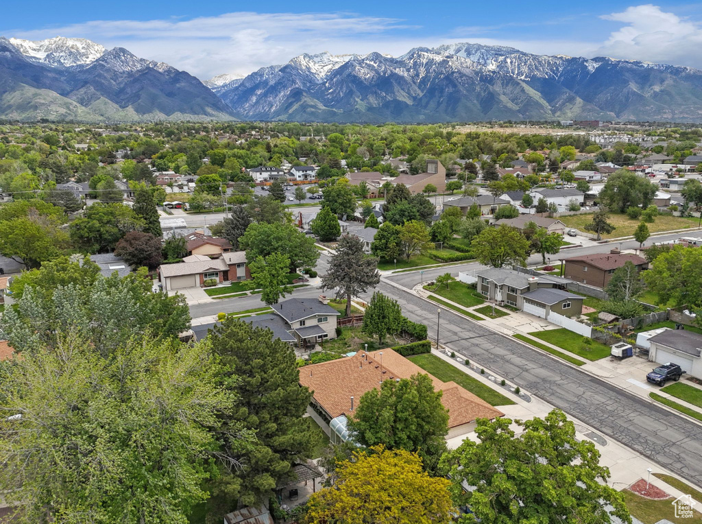 Aerial view of residential area featuring a mountainous background