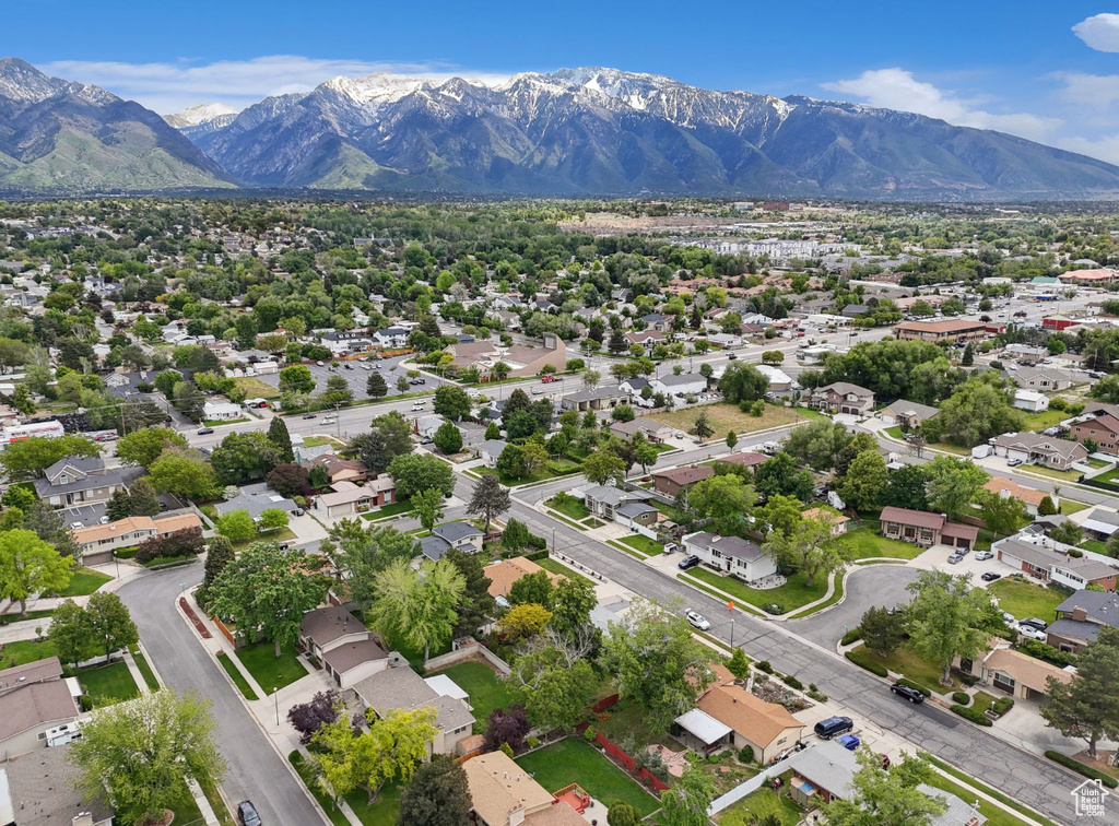 Aerial perspective of suburban area featuring a mountain backdrop