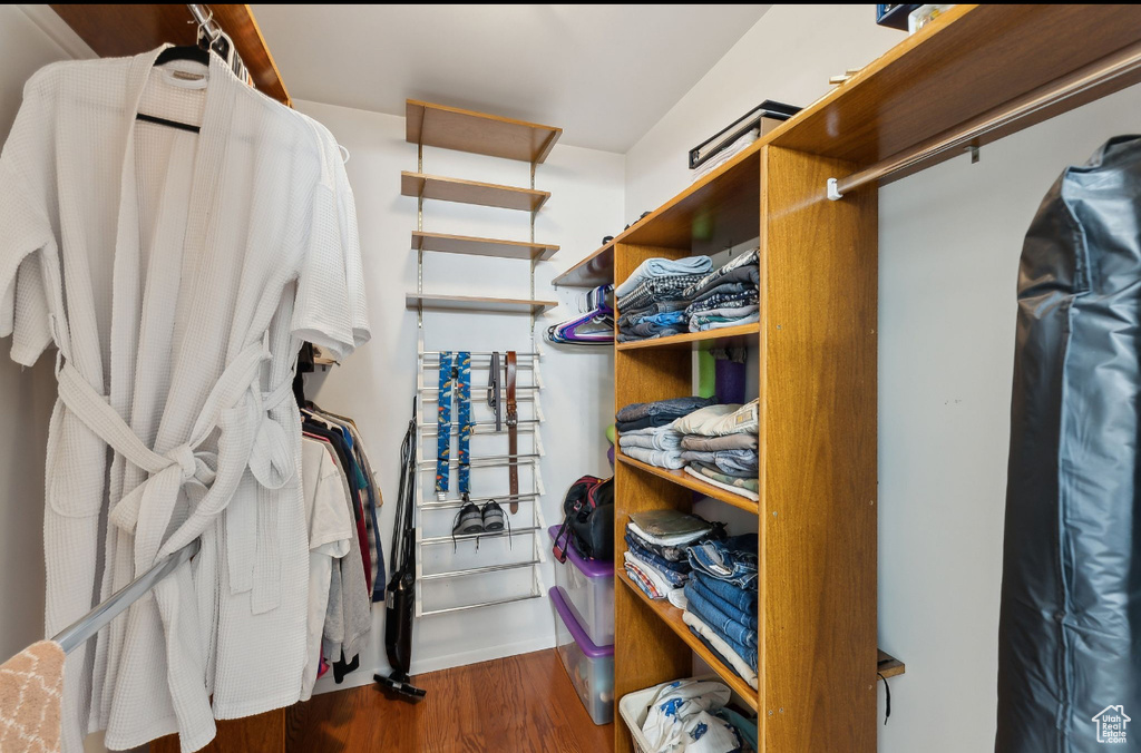 Walk in closet featuring wood finished floors
