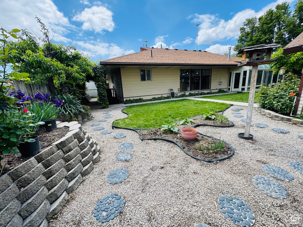 Rear view of property featuring a patio
