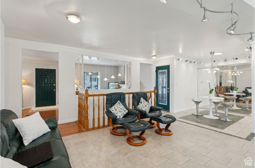 Living room with a chandelier and baseboards