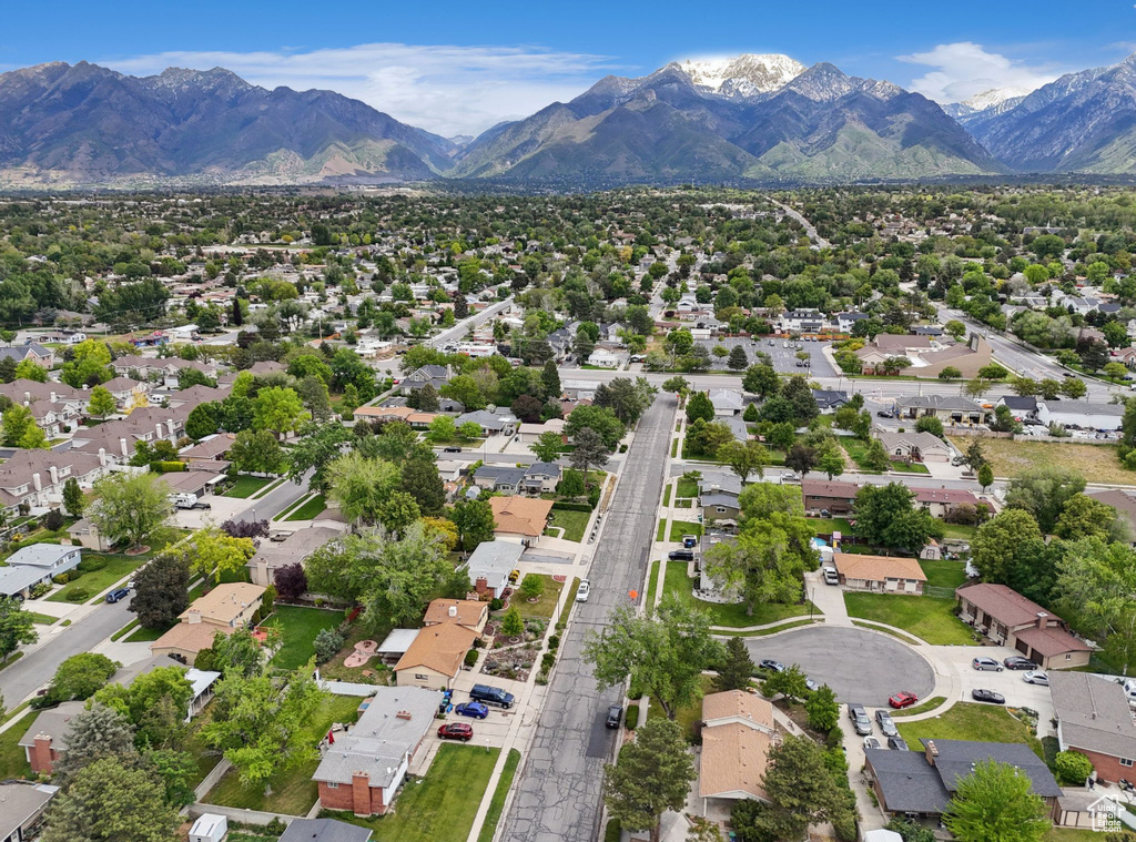 Aerial view of residential area featuring mountains