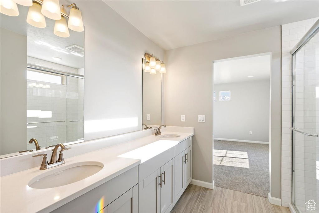 Bathroom with healthy amount of natural light and tiled shower