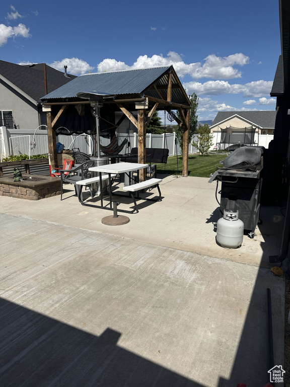 View of patio / terrace with a gazebo, area for grilling, and outdoor dining area