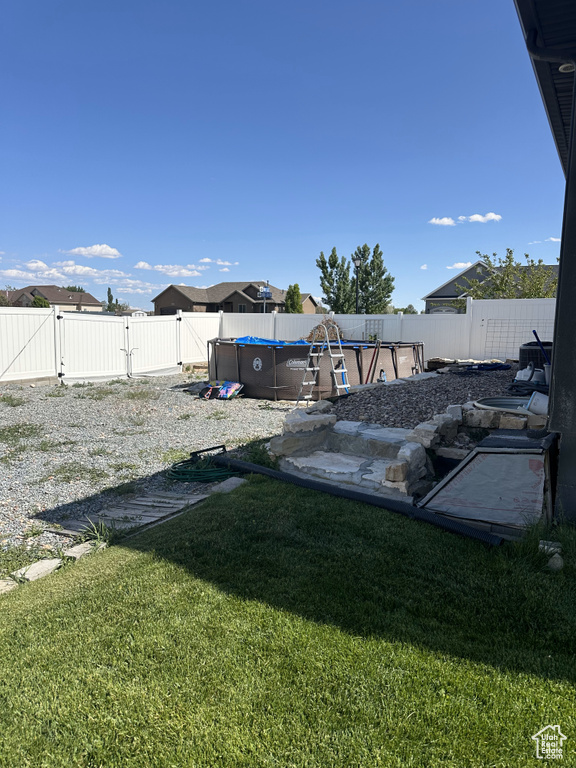 View of yard with a gate